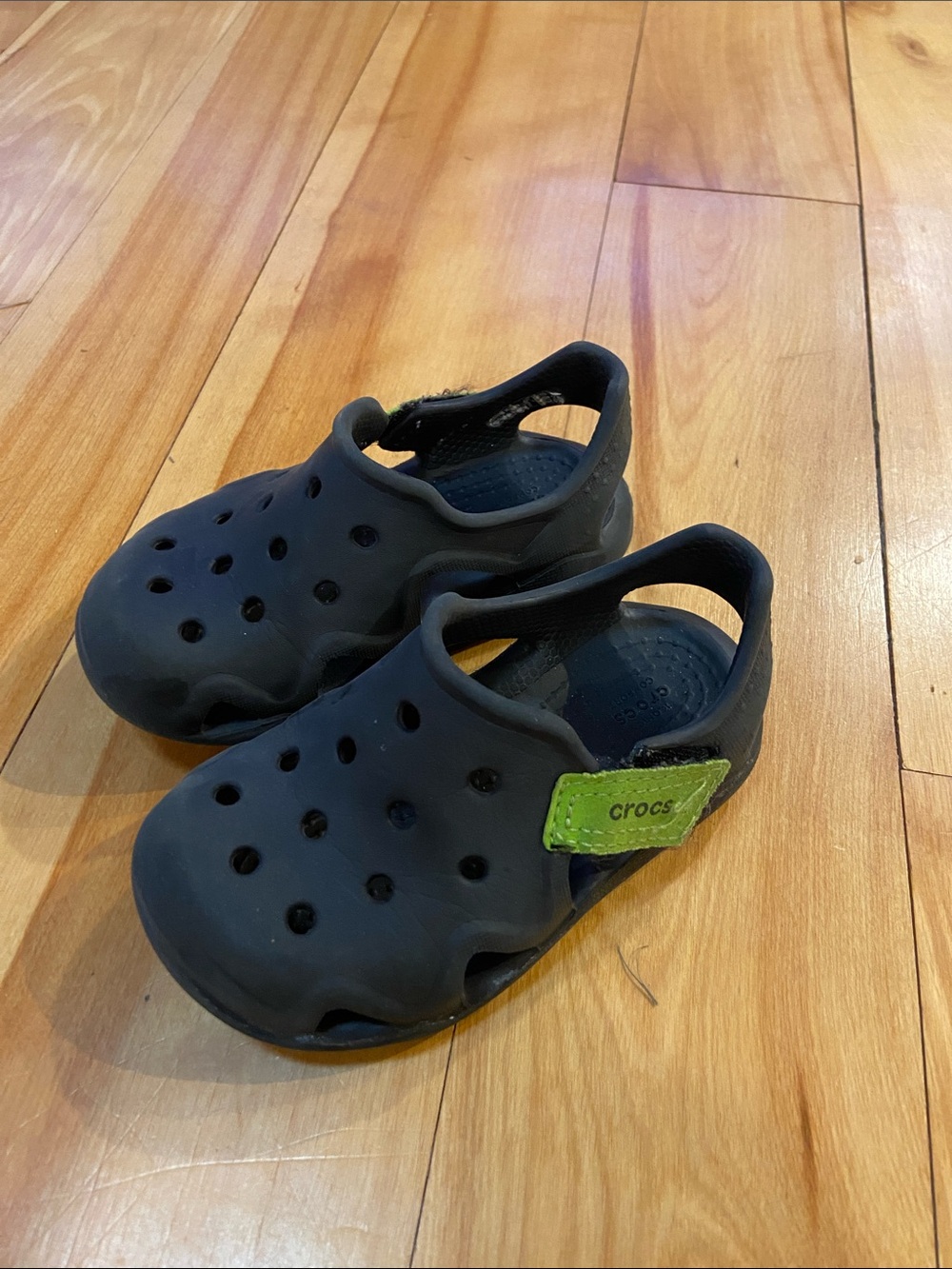 CROCS Kids Black Clogs with Green Strap. Size 7. Great water shoes.